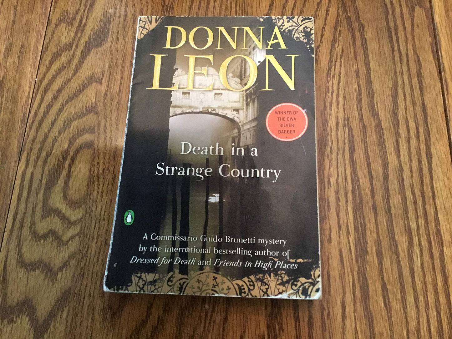 Death in a Strange Country: A Commissario Guido Brunetti Mystery